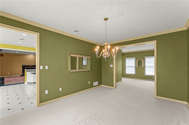 unfurnished room featuring a chandelier, ornamental molding, baseboards, and carpet
