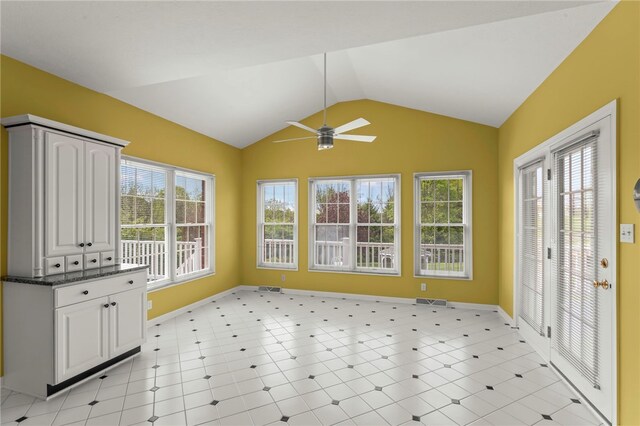 unfurnished sunroom with lofted ceiling