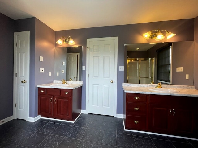 full bathroom with baseboards, a stall shower, tile patterned flooring, and two vanities