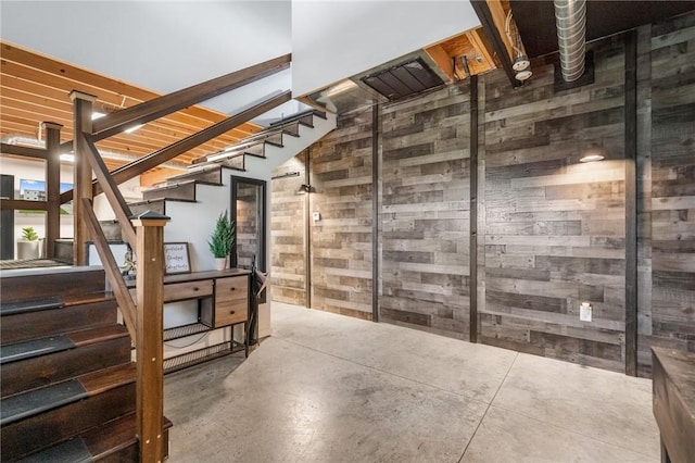 below grade area with stairs and wooden walls