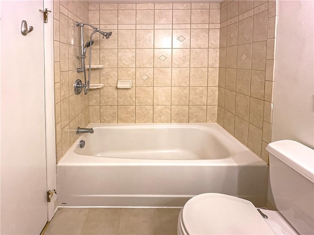 full bathroom with toilet, tile patterned floors, and tub / shower combination