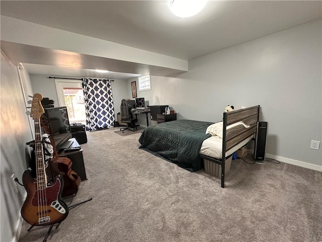 bedroom with carpet and baseboards