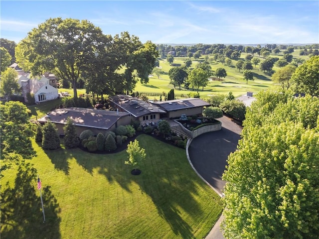 view of subject property with a golf course