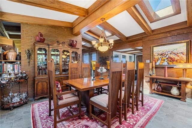 dining room featuring wooden walls, a chandelier, stone finish flooring, and beam ceiling