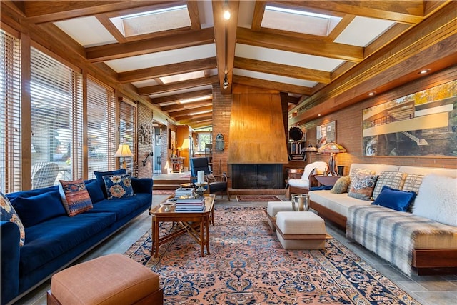 living room featuring a fireplace and a skylight