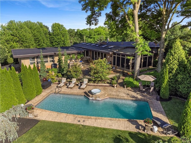 swimming pool featuring a patio area