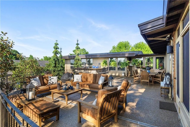 view of patio / terrace with an outdoor living space and outdoor dining area