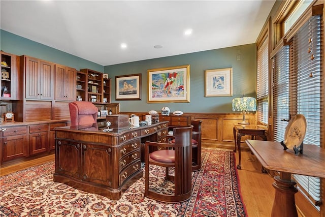 office area with wood finished floors, a wainscoted wall, and recessed lighting