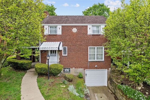 2405 Whited St, Brookline, PA 15226 - view of front of house with a garage, brick siding, concrete driveway, and a chimney