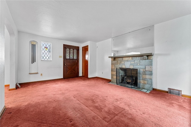 2405 Whited St, Brookline, PA 15226 - unfurnished living room featuring a stone fireplace, carpet floors, and baseboards
