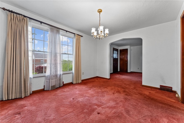 2405 Whited St, Brookline, PA 15226 - carpeted empty room with arched walkways, baseboards, and a chandelier