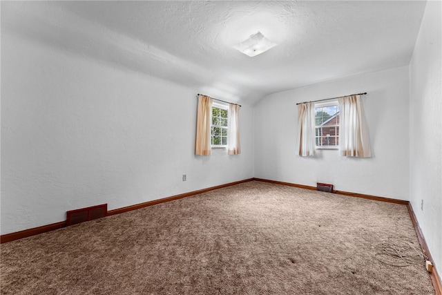 2405 Whited St, Brookline, PA 15226 - unfurnished room with carpet, vaulted ceiling, baseboards, and a textured ceiling
