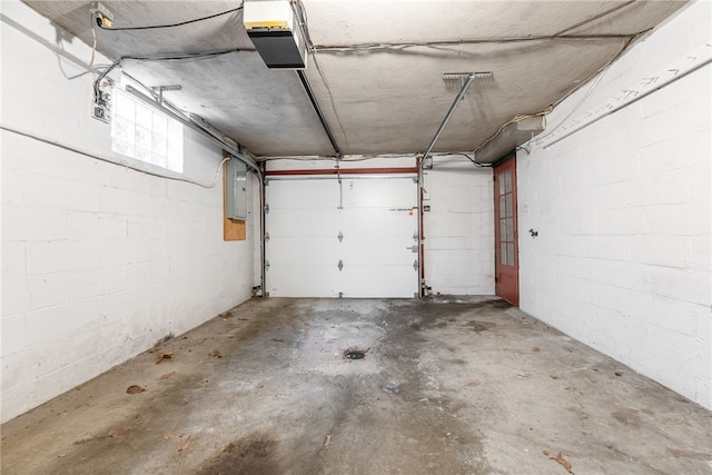2405 Whited St, Brookline, PA 15226 - garage with a garage door opener, electric panel, and concrete block wall