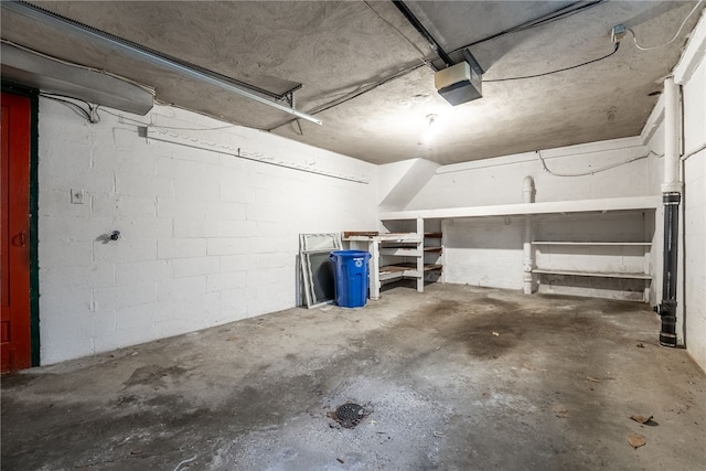 2405 Whited St, Brookline, PA 15226 - garage featuring a garage door opener and concrete block wall