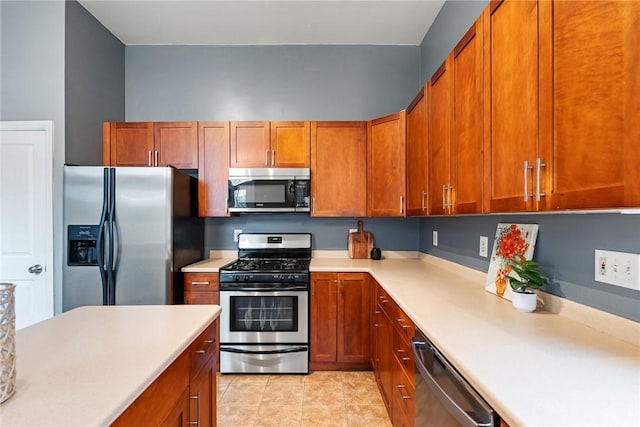 526 Armandale St, Central North Side, PA 15212 - kitchen with stainless steel appliances, light countertops, and brown cabinetry