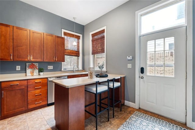 526 Armandale St, Central North Side, PA 15212 - kitchen featuring dishwasher, a sink, a kitchen bar, light countertops, and brown cabinets