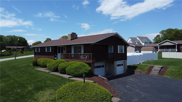 ranch-style house featuring asphalt driveway, a garage, and a chimney