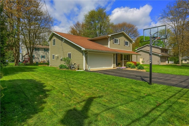 view of front of property featuring driveway, a garage, a front lawn, and roof with shingles