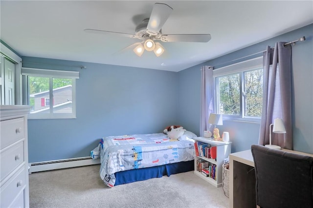 12494 Hickory Dr, Conneaut Lake Cra, PA 16316 - carpeted bedroom with a baseboard heating unit and a ceiling fan