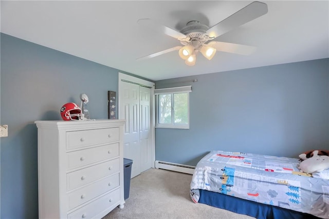 12494 Hickory Dr, Conneaut Lake Cra, PA 16316 - bedroom featuring a baseboard heating unit, carpet floors, a closet, and ceiling fan