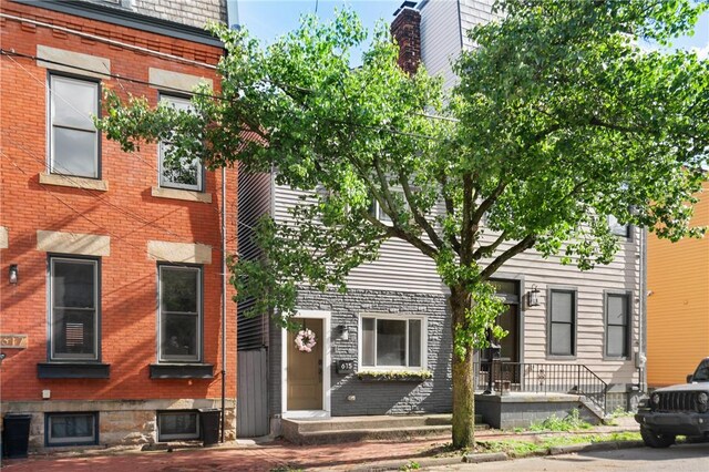 multi unit property featuring brick siding