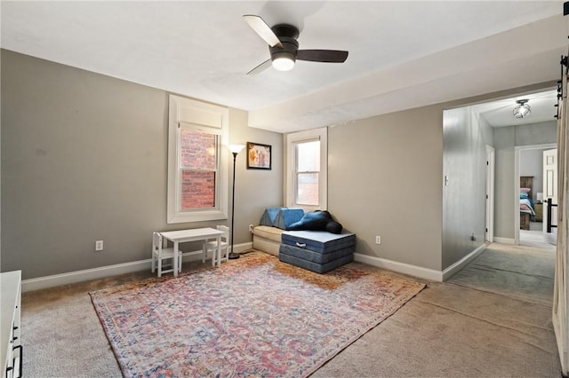 bedroom with carpet floors, baseboards, and ceiling fan
