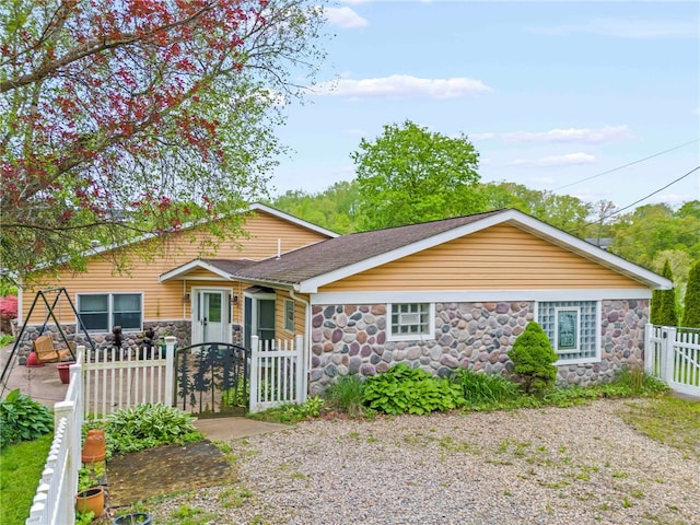 128 Evergreen Dr, Peters Twp, PA 15317 - view of front of home featuring stone siding and a gate