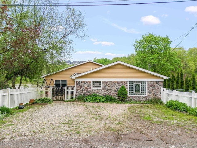 128 Evergreen Dr, Peters Twp, PA 15317 - view of front facade with stone siding and a gate
