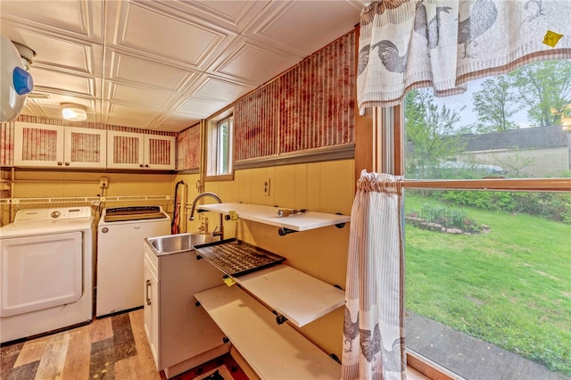 128 Evergreen Dr, Peters Twp, PA 15317 - clothes washing area with washing machine and clothes dryer, an ornate ceiling, light wood-type flooring, and a sink