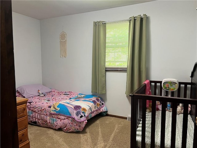 bedroom featuring carpet flooring and baseboards