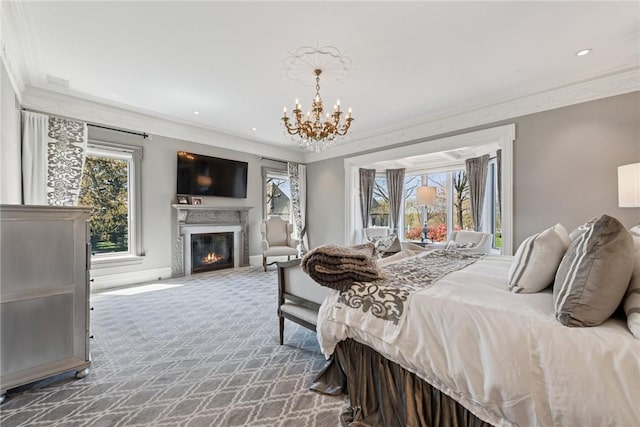 carpeted bedroom with crown molding, a fireplace with flush hearth, a chandelier, baseboards, and recessed lighting