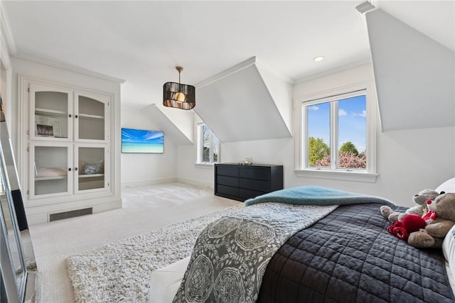 carpeted bedroom with ornamental molding, vaulted ceiling, and baseboards