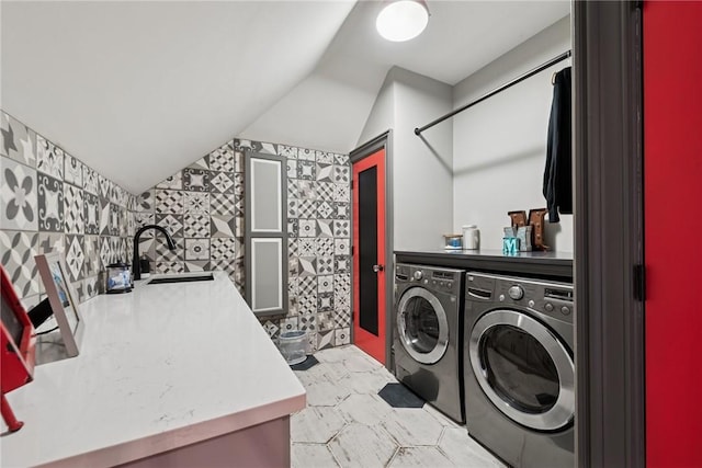 laundry area with washing machine and dryer and light flooring