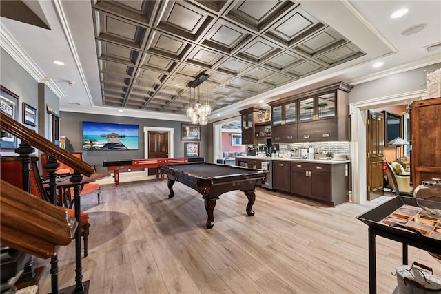 game room featuring billiards, light wood-type flooring, bar, and ornamental molding
