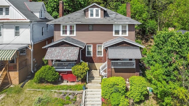 554 Forest Ave, Bellevue, PA 15202 - view of front of property featuring a chimney, stairway, brick siding, and roof with shingles