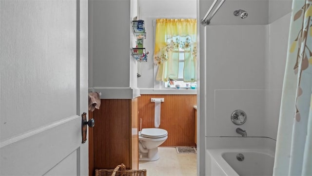 554 Forest Ave, Bellevue, PA 15202 - bathroom featuring bathtub / shower combination, toilet, and a wainscoted wall