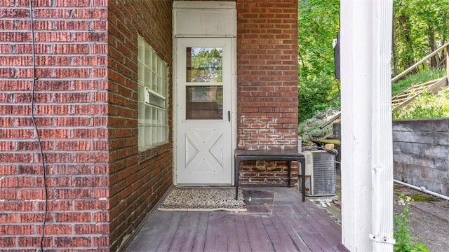 554 Forest Ave, Bellevue, PA 15202 - doorway to property featuring brick siding, a wooden deck, and central AC