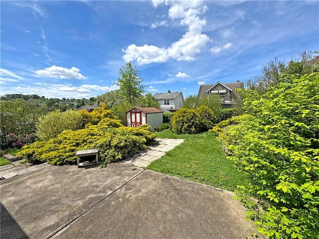 456 Antenor Ave, Overbrook, PA 15210 - view of green lawn featuring a storage unit and an outbuilding