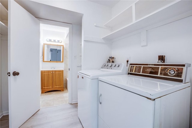 washroom with washer and dryer