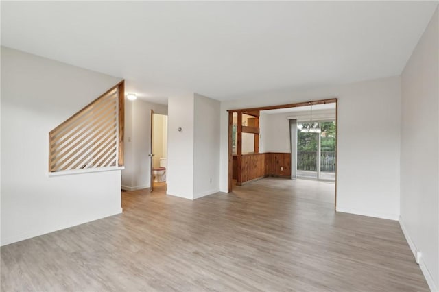 207 Parkwood Dr, Cranberry Twp, PA 16066 - spare room with a chandelier, light wood-type flooring, and baseboards