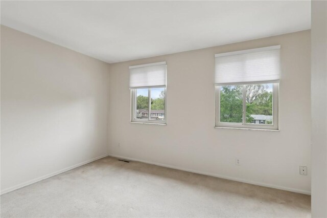 207 Parkwood Dr, Cranberry Twp, PA 16066 - unfurnished room with plenty of natural light, light colored carpet, and baseboards