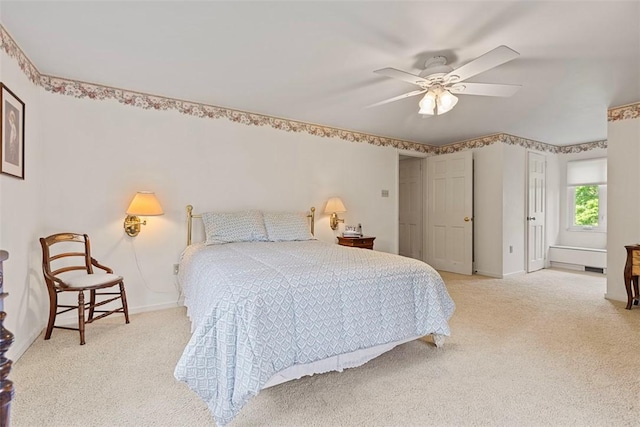 bedroom with light colored carpet, ceiling fan, and baseboards