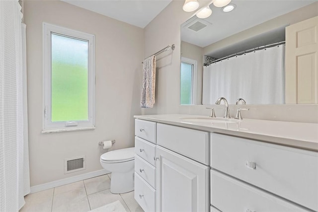 full bathroom featuring vanity, toilet, baseboards, and tile patterned flooring