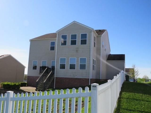 rear view of house with stairway