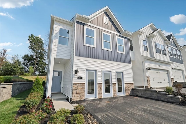 122 River Ridge Drive, Moon/Crescent Twp, PA 15108 - view of property with board and batten siding and stone siding