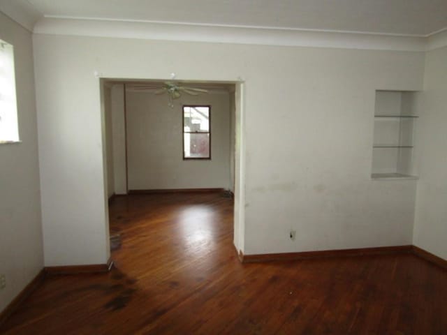 643 Indiana Ave, Glassport, PA 15045 - empty room featuring wood-type flooring, baseboards, and a ceiling fan