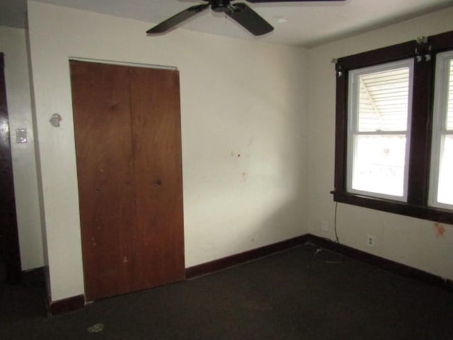 643 Indiana Ave, Glassport, PA 15045 - unfurnished bedroom featuring multiple windows, baseboards, and a closet