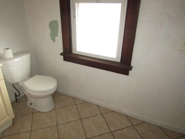 643 Indiana Ave, Glassport, PA 15045 - bathroom featuring toilet, baseboards, and tile patterned flooring