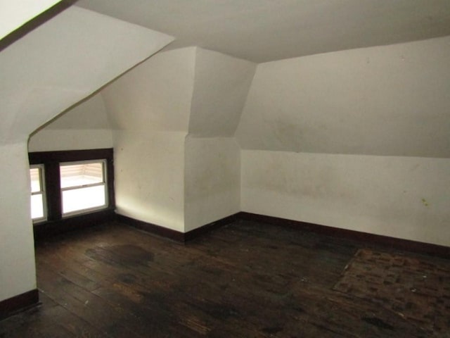 643 Indiana Ave, Glassport, PA 15045 - additional living space featuring dark wood-style flooring, baseboards, and lofted ceiling