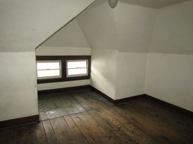 643 Indiana Ave, Glassport, PA 15045 - additional living space with dark wood-style floors, baseboards, and lofted ceiling